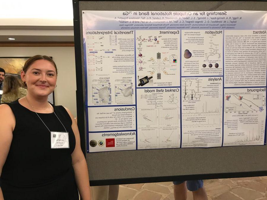 Student Natalie Fogg explains her research at the Nuclear Physics Divisions of the American and Japanese Physics Societies 